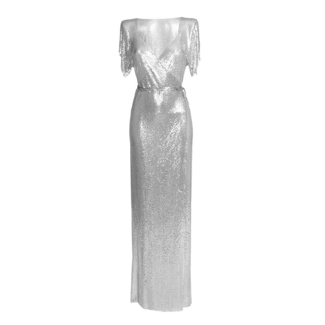 Floor-length silver chainmail maxi dress with smooth metallic finish, a show-stopping statement gown