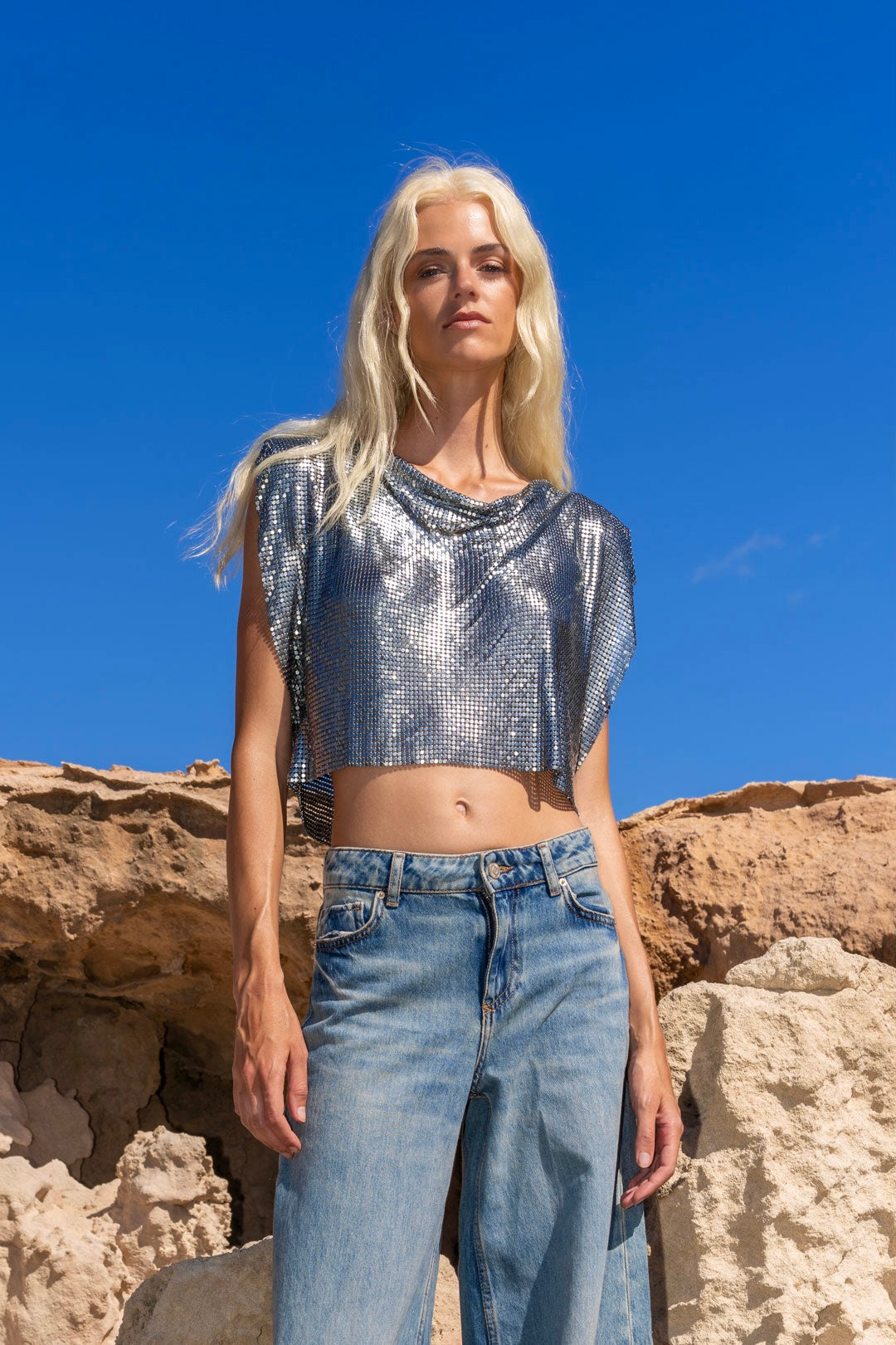 Edgy gunmetal chainmail crop top, perfect for rock-inspired style