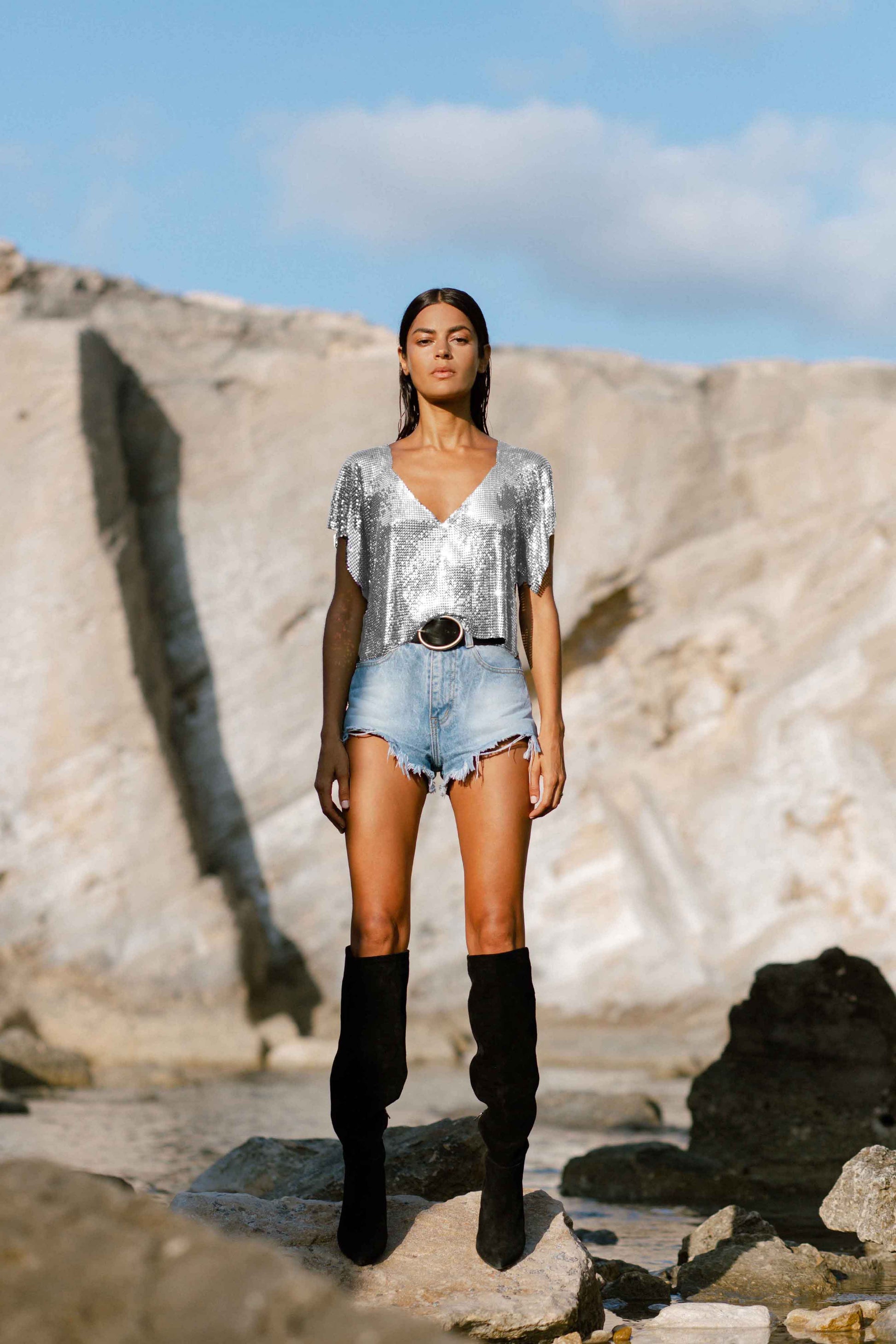 Eco-conscious silver V-neck chainmail metal top, bold and elegant with a relaxed fit