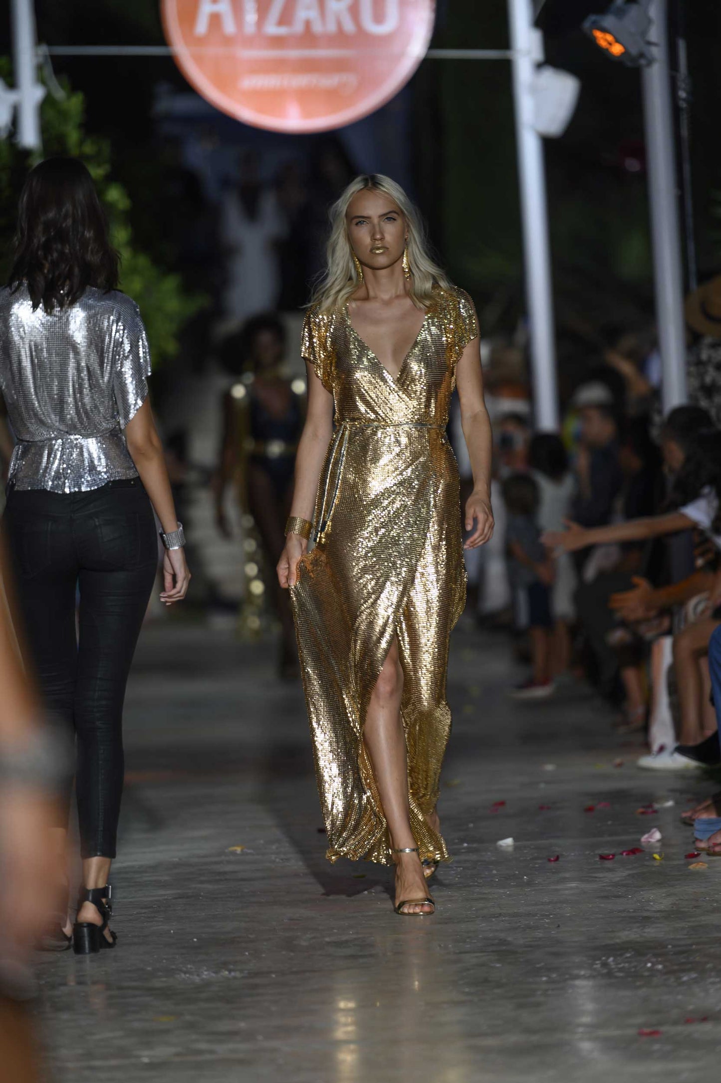 Floor-length gold chainmail maxi dress with smooth metallic finish, a show-stopping statement gown