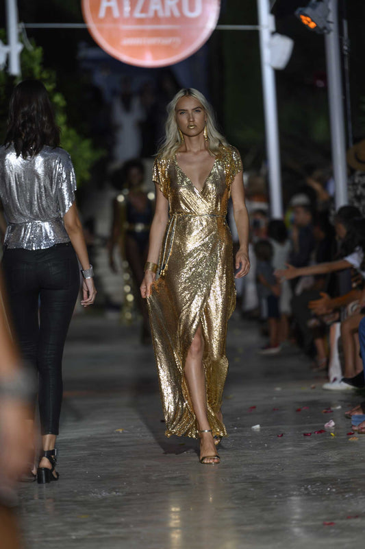 Floor-length gold chainmail maxi dress with smooth metallic finish, a show-stopping statement gown