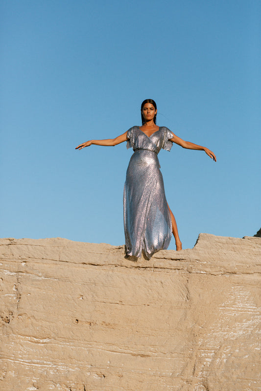 Floor-length gunmetal chainmail maxi dress with smooth metallic finish, a show-stopping statement gown
